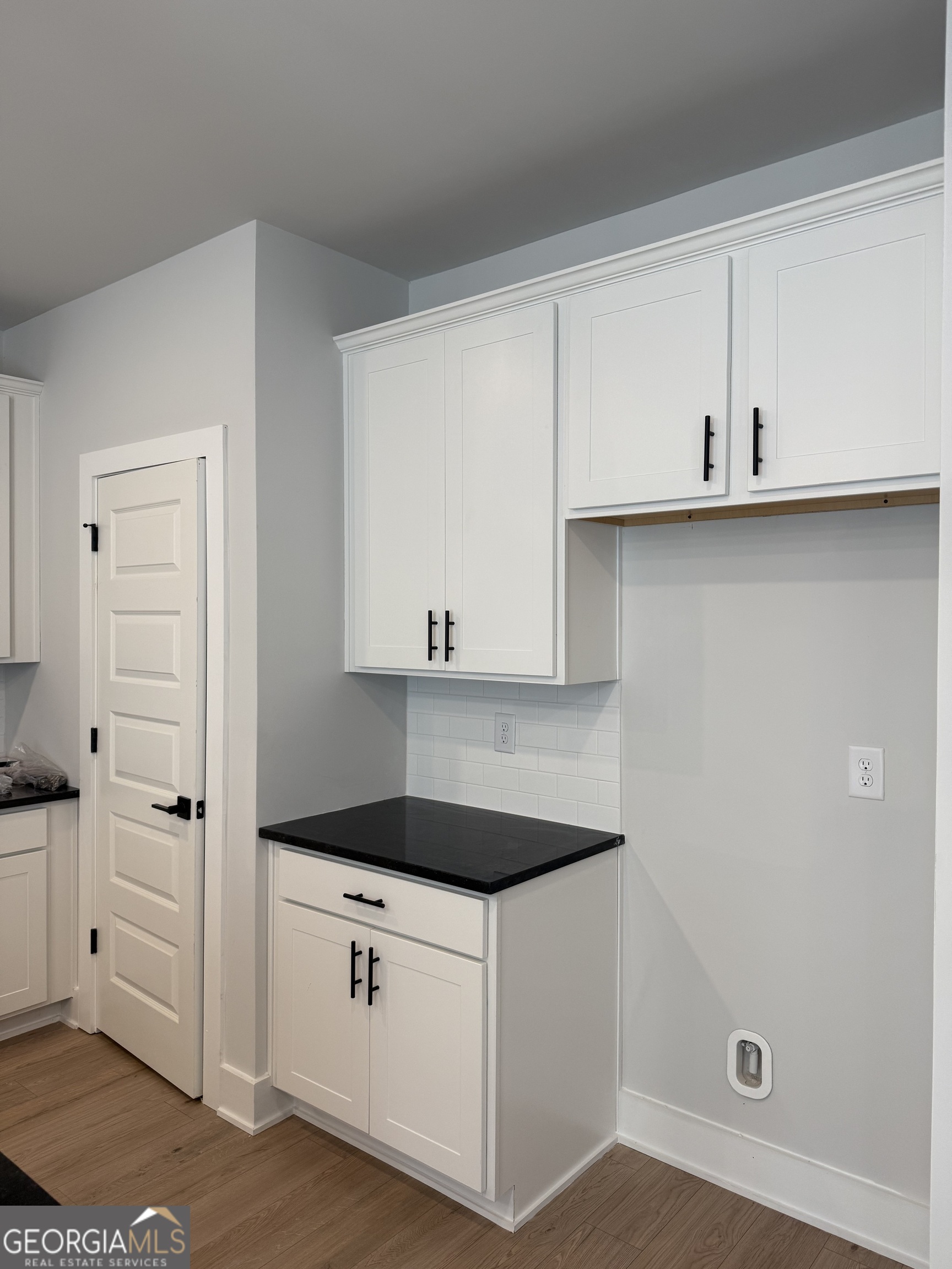 210 Villa Rica Springs Villa Rica, GA 30180 - Photo 9 of 24 a kitchen with white cabinets and a sink