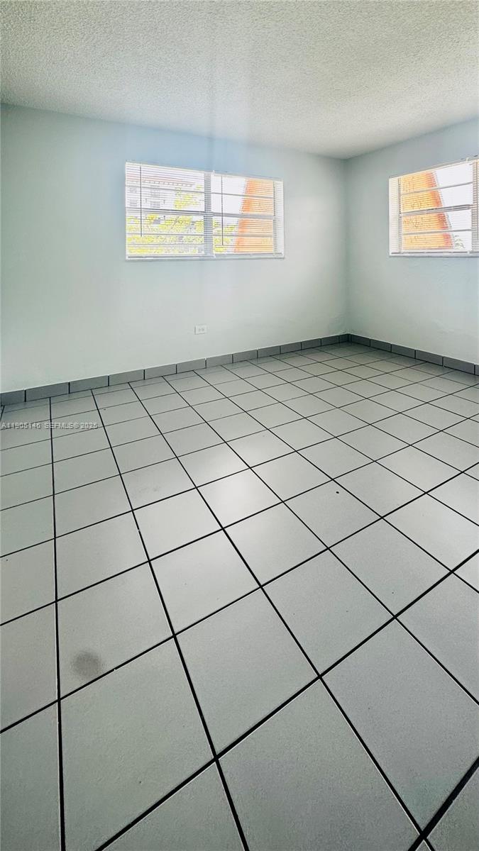 8101 Southwest 73rd Avenue, Unit 20 Miami, FL 33143 - Photo 14 of 18 a view of an empty room and window