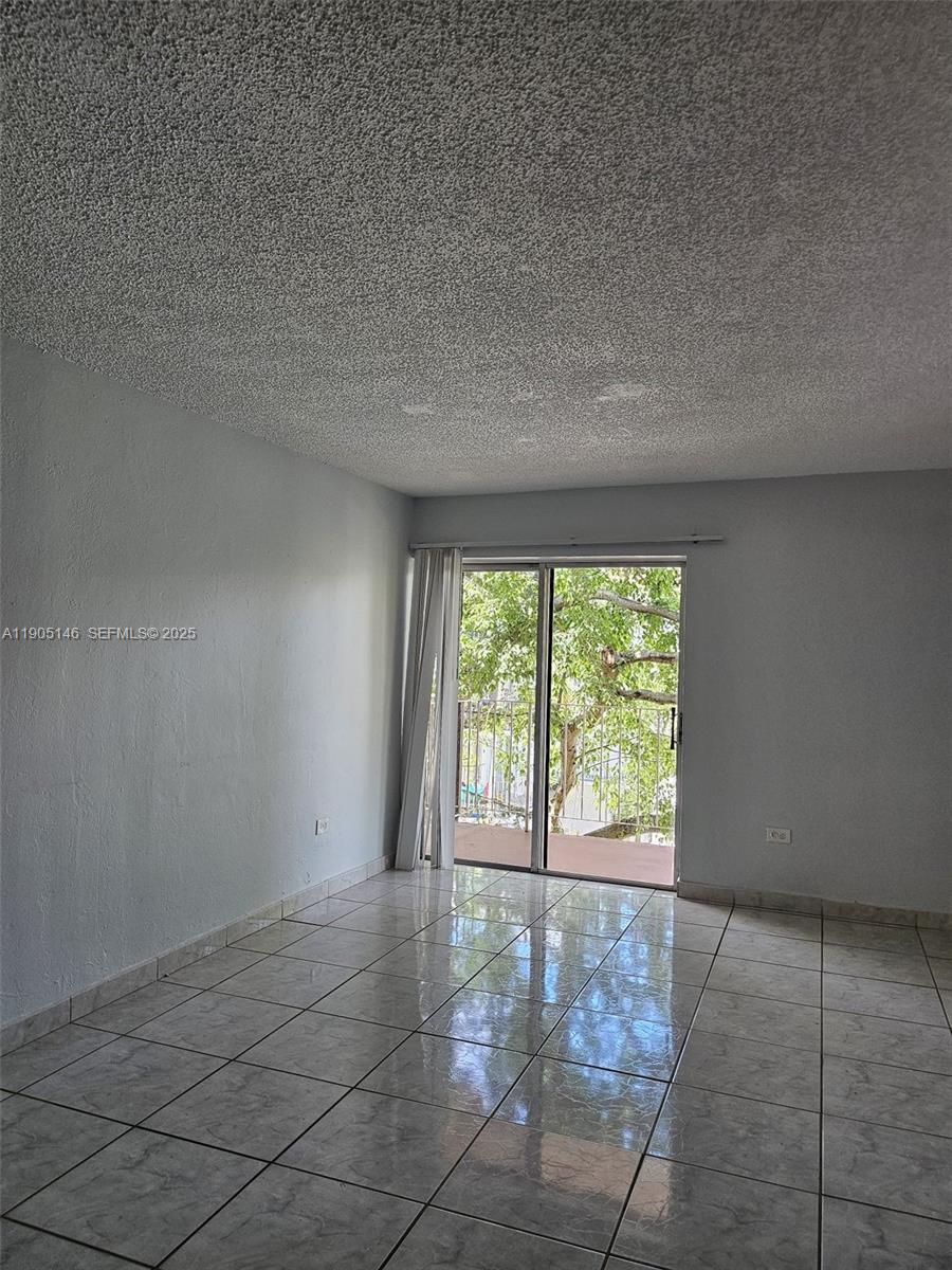 8101 Southwest 73rd Avenue, Unit 20 Miami, FL 33143 - Photo 2 of 18 a view of an empty room with a window