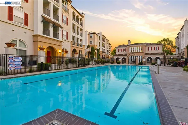 an aerial view of residential houses with outdoor space and river view