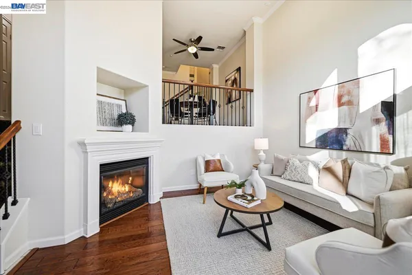 a living room with furniture and a floor to ceiling window