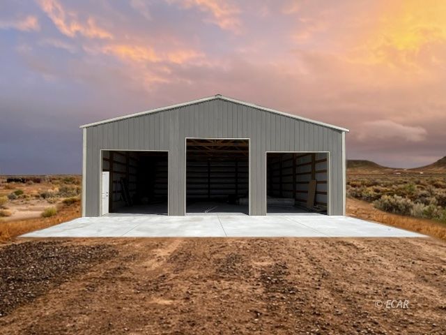 115 Blue Ridge Road Battle Mountain, NV 89820 - Photo 2 of 14 a front view of a house with a yard and garage