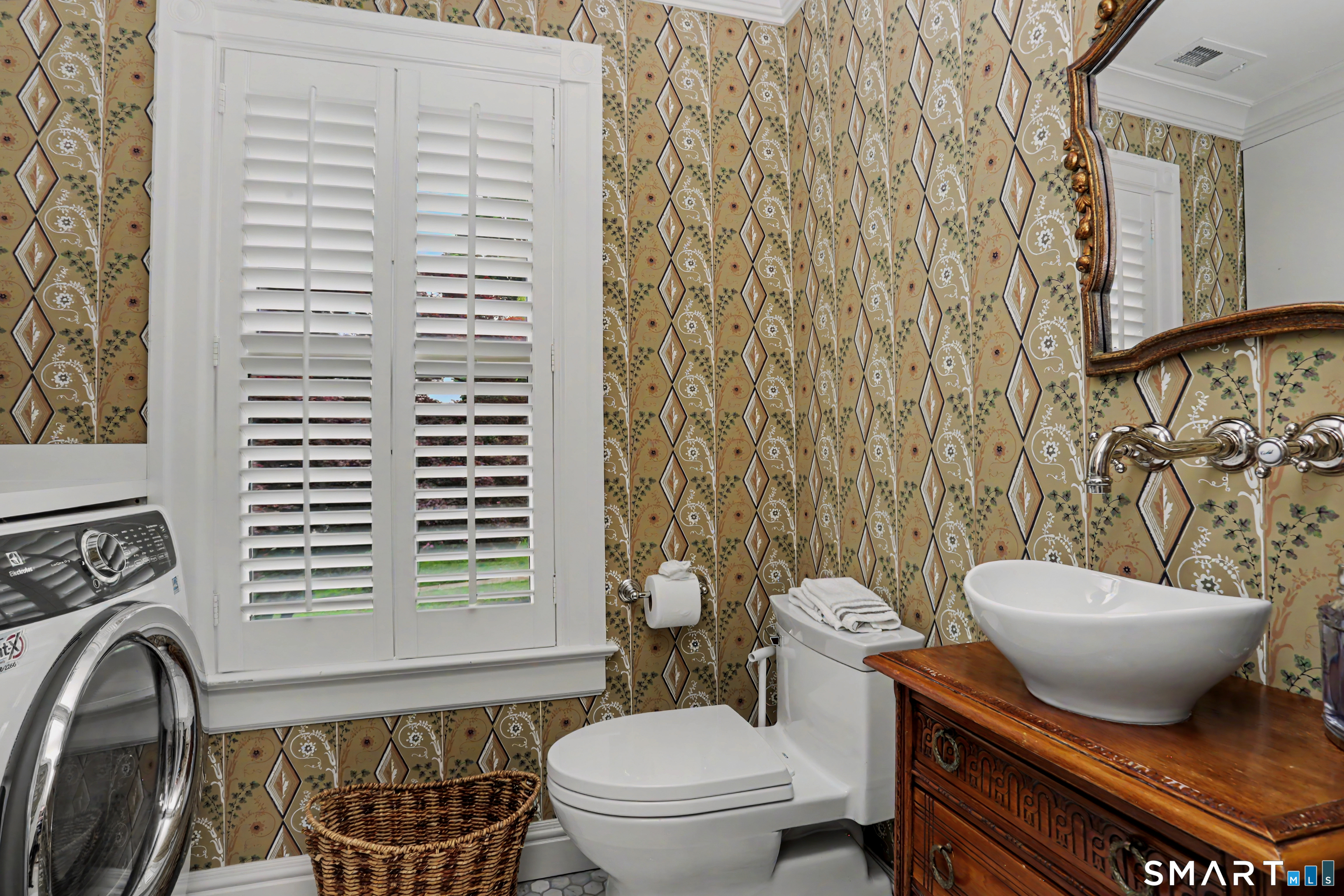 36 Catoonah Street, Unit 18 Ridgefield, CT 06877 - Photo 24 of 40 a bathroom with a toilet a sink and a mirror