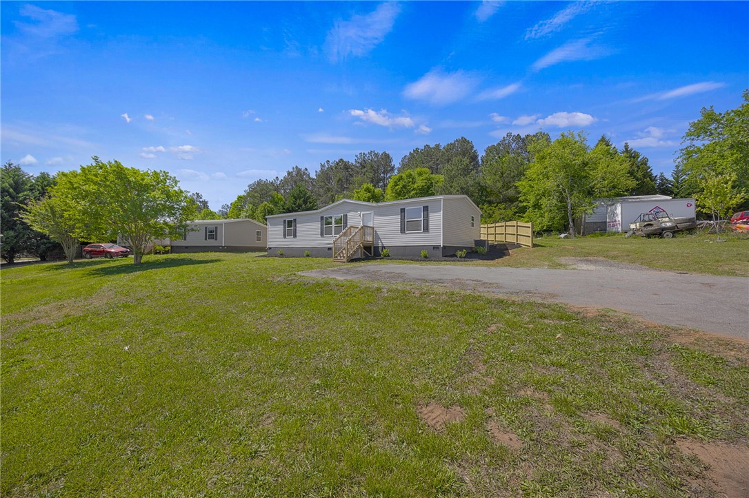 375 Griggs Road Six Mile, SC 29682 - Photo 5 of 36 This expansive property offers a versatile outdoor environment with ample space for various activities.