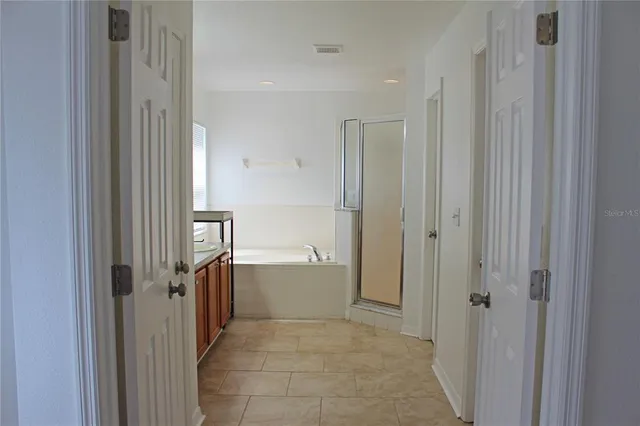 a bathroom with a bathtub and shower