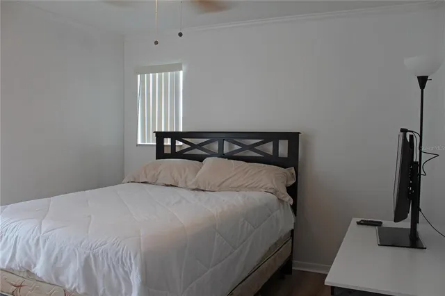 a bedroom with a bed and window