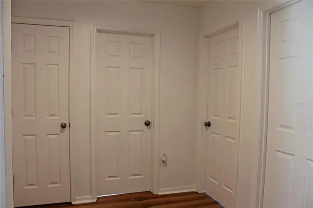 a view of room with hardwood floor