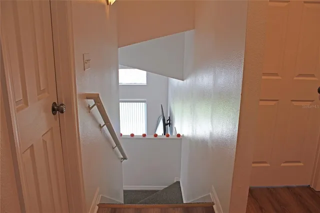 a view of a hallway with staircase