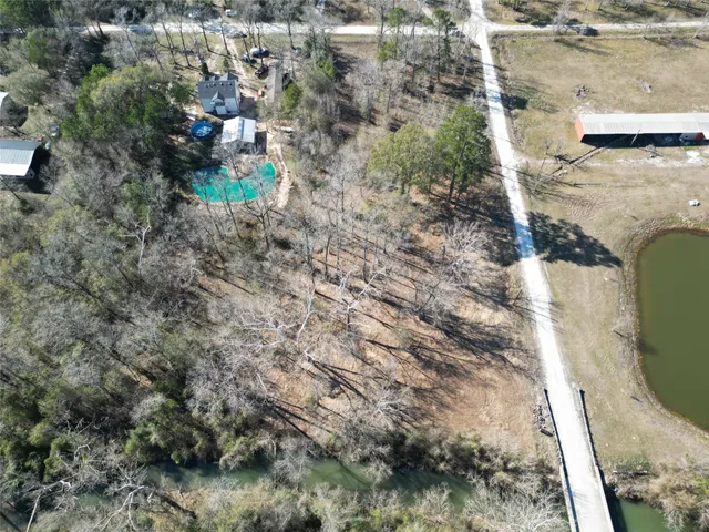 a view of a wooden house with a yard