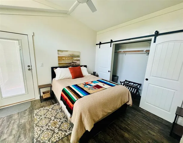 a open kitchen with stainless steel appliances granite countertop a stove refrigerator and microwave