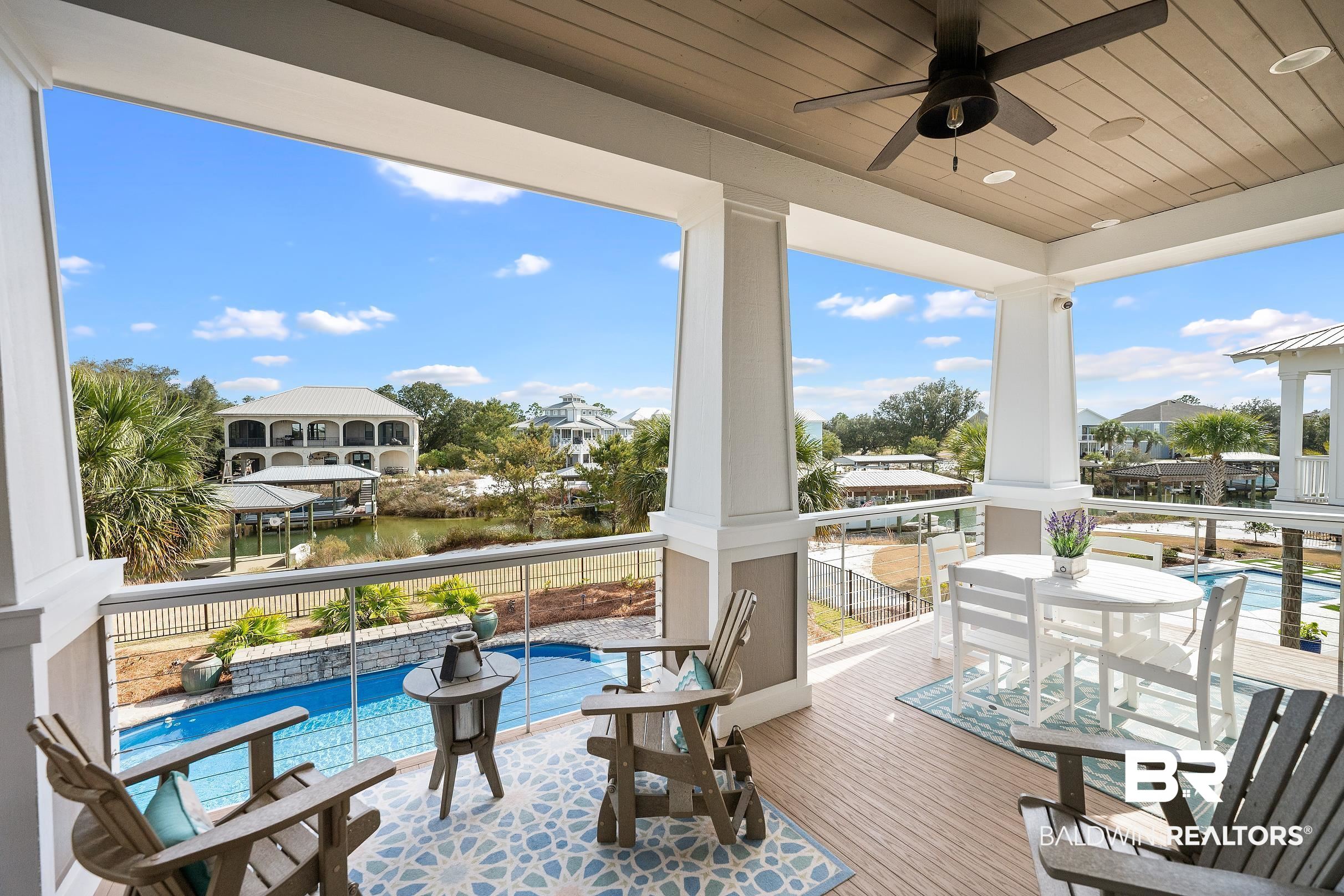 33186 Marlin Key Drive Orange Beach, AL 36561 - Photo 26 of 87 Patio / terrace featuring ceiling fan, outdoor dining space, and a water view