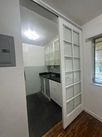 a view of storage and utility room with empty racks
