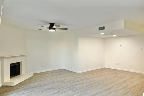 a kitchen with stainless steel appliances white cabinets and a stove top oven