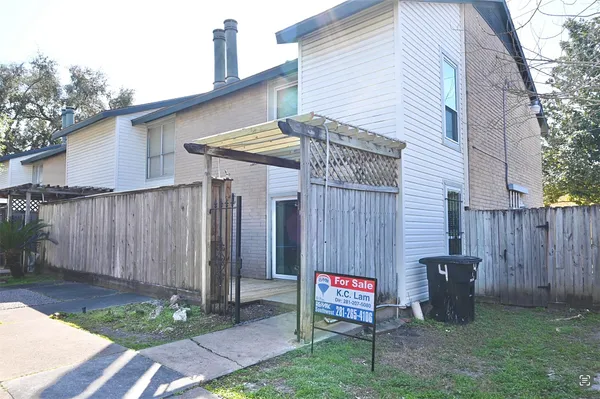 a view of a chairs and table in the backyard