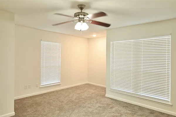 a bathroom with a granite countertop sink mirror and vanity