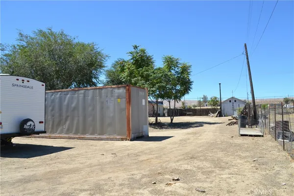 a wooden bench sitting in the middle of a lake