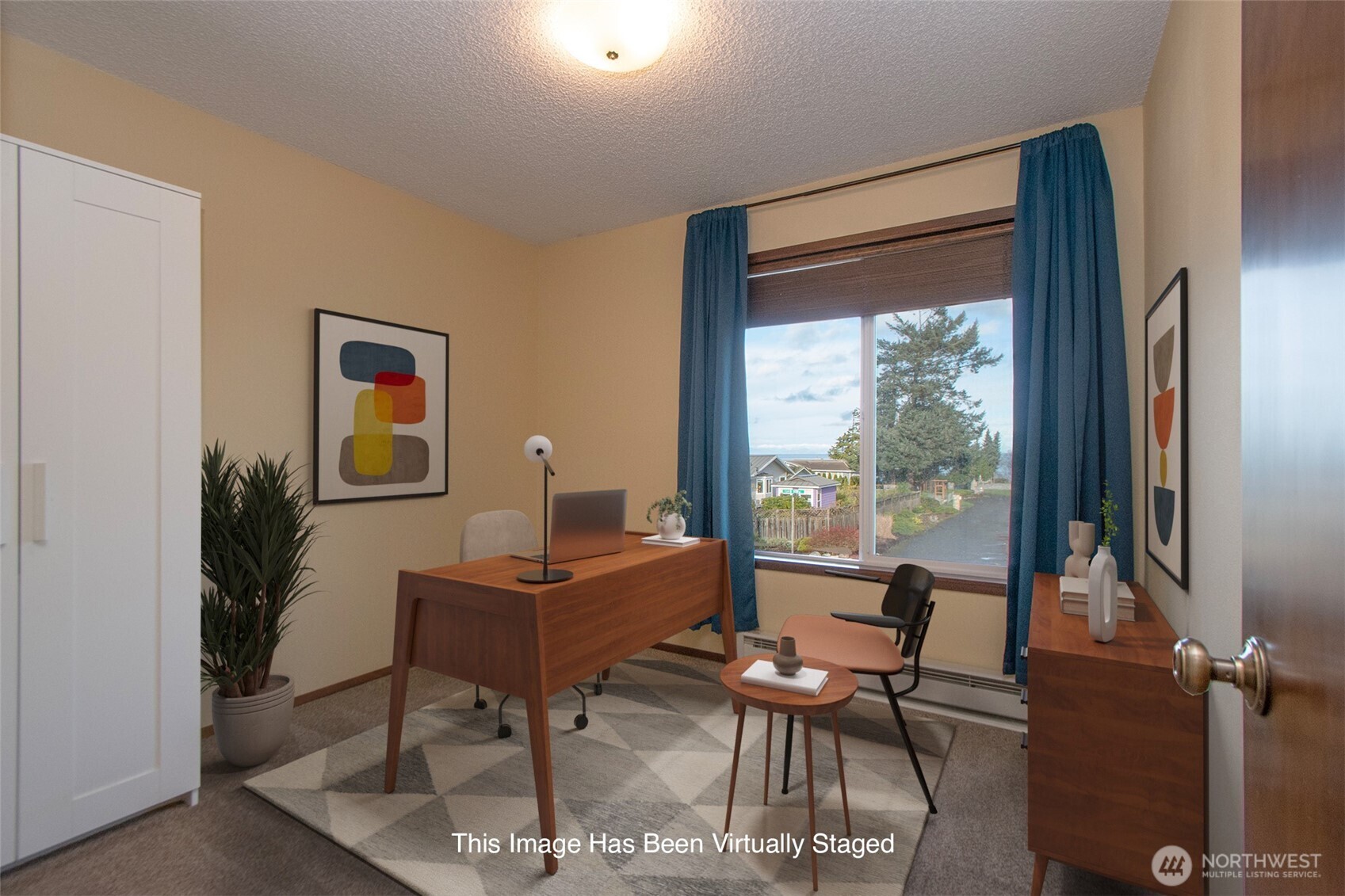 103 Island View Road Port Angeles, WA 98362 - Photo 11 of 40 a view of a workspace with furniture and a window