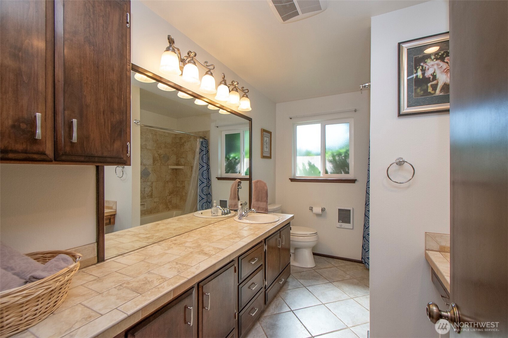 103 Island View Road Port Angeles, WA 98362 - Photo 12 of 40 a bathroom with a granite countertop sink a mirror and a toilet