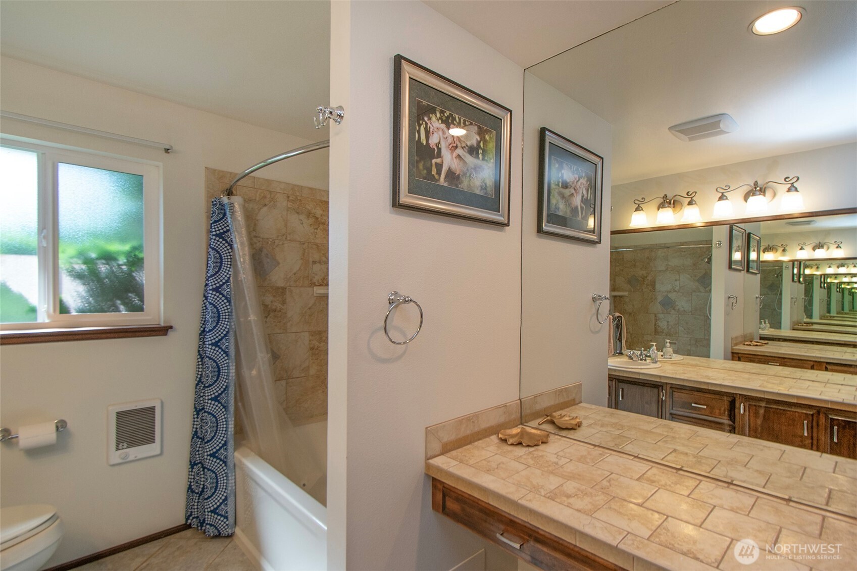 103 Island View Road Port Angeles, WA 98362 - Photo 13 of 40 a bathroom with a granite countertop sink a mirror and a shower