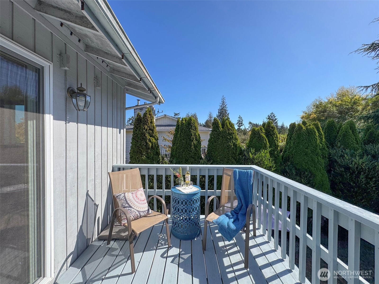 103 Island View Road Port Angeles, WA 98362 - Photo 17 of 40 a view of a chair and tables in the balcony