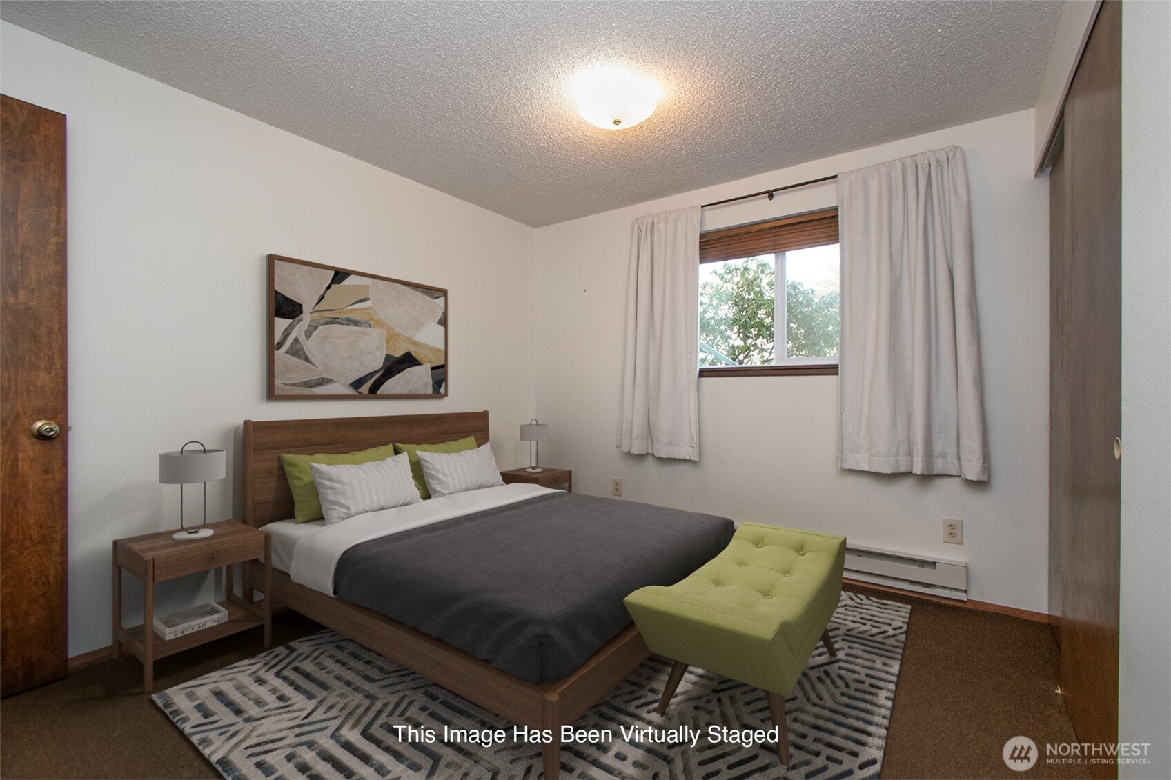 103 Island View Road Port Angeles, WA 98362 - Photo 23 of 40 a bedroom with a bed and a couch