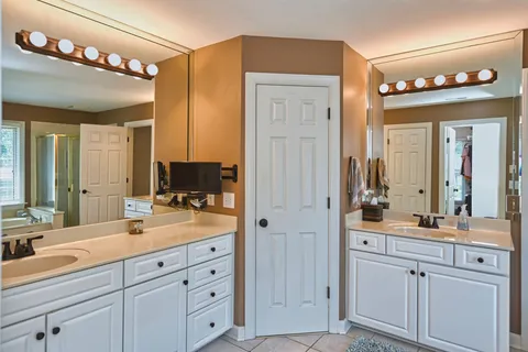 a bathroom with a sink and a mirror