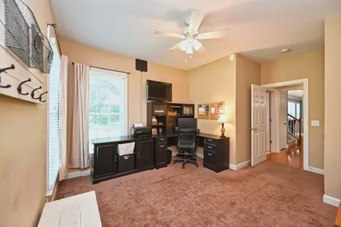 a workspace with furniture and window