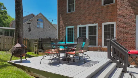 a sitting area with furniture on the deck