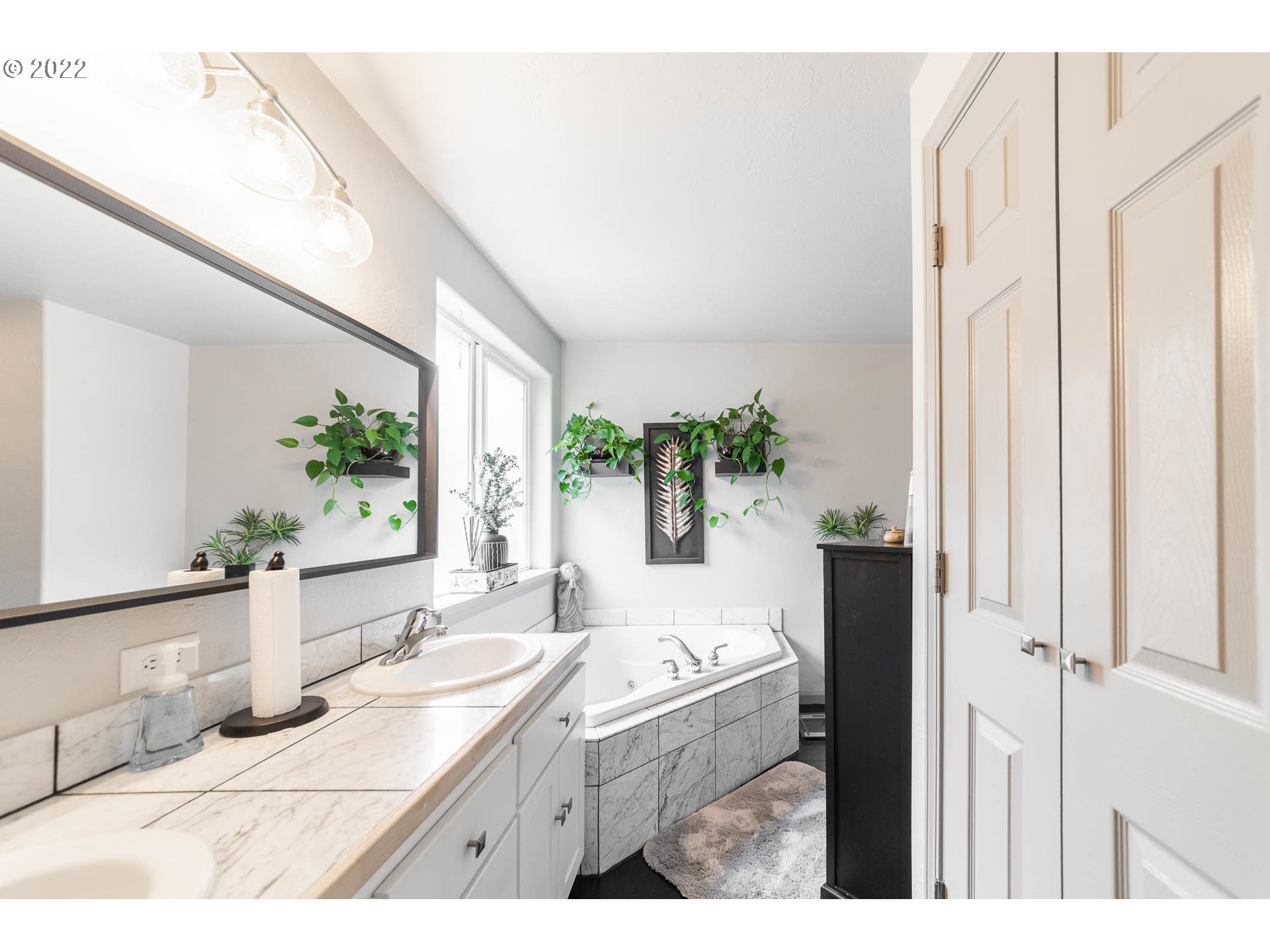 659 62nd Street Springfield, OR 97478 - Photo 13 of 32 a bathroom with a granite countertop sink and a large mirror
