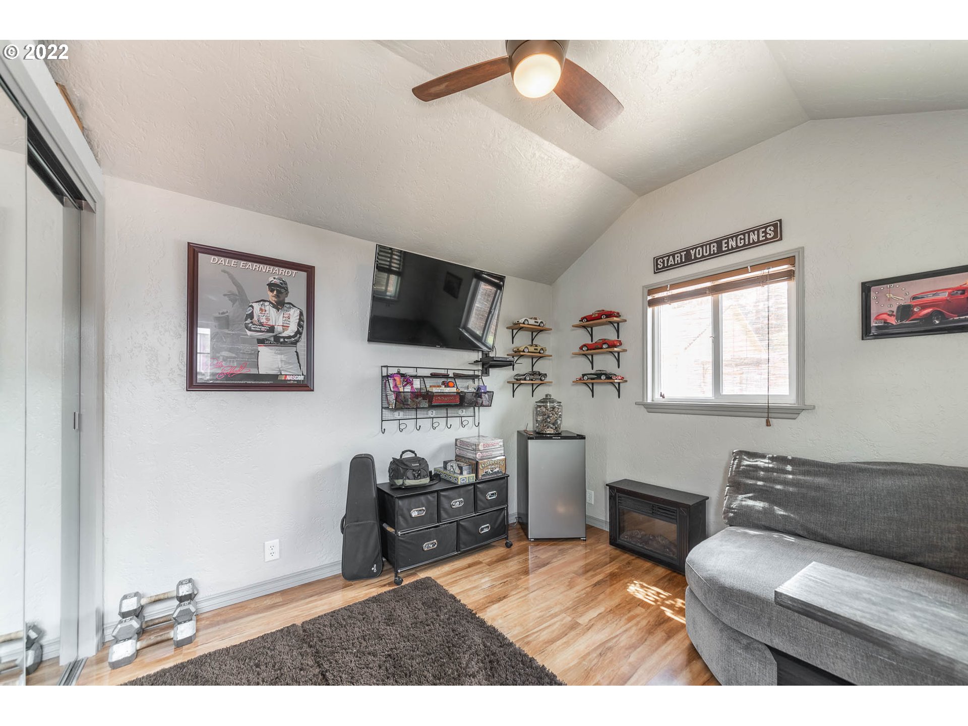 659 62nd Street Springfield, OR 97478 - Photo 31 of 32 a living room with furniture and a flat screen tv