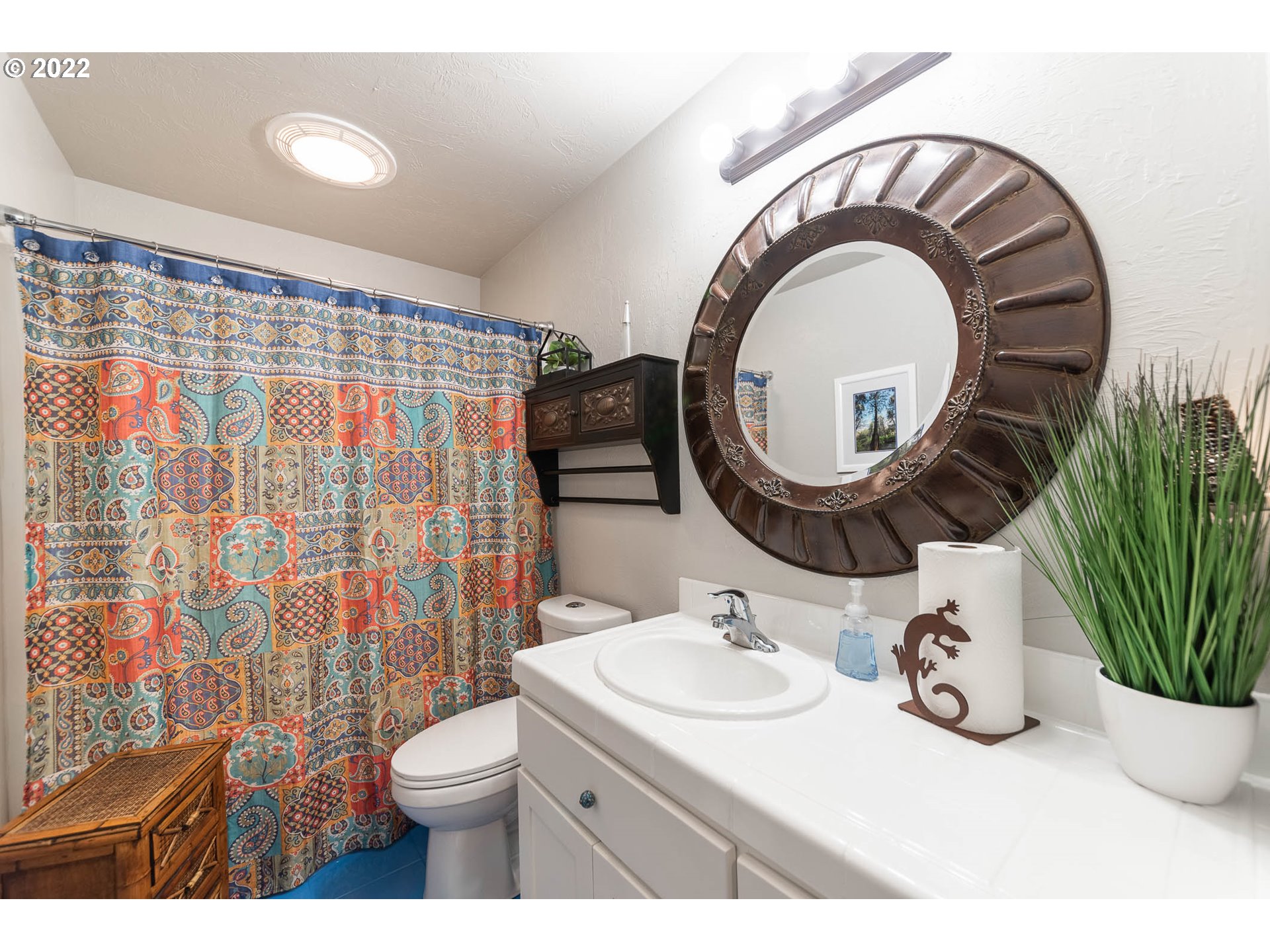 659 62nd Street Springfield, OR 97478 - Photo 8 of 32 a bathroom with a sink a mirror and a toilet