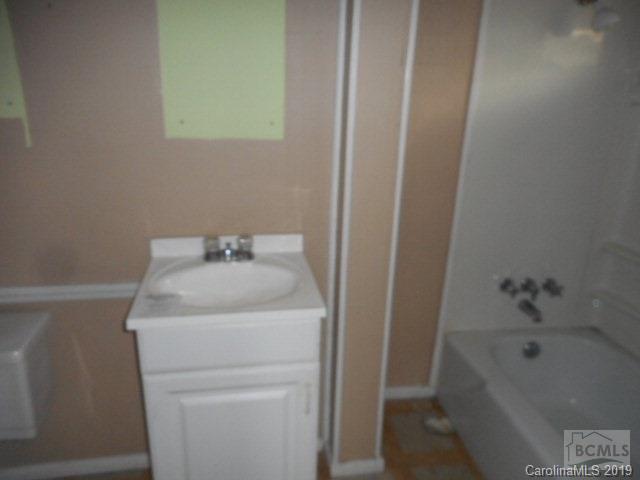 453 Poors Ford Road Rutherfordton, NC 28139 - Photo 2 of 15 a bathroom with a sink and a bathtub