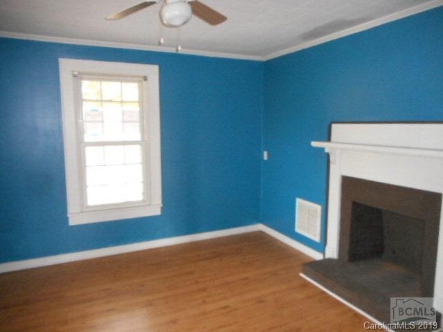 453 Poors Ford Road Rutherfordton, NC 28139 - Photo 11 of 15 a view of empty room with fireplace