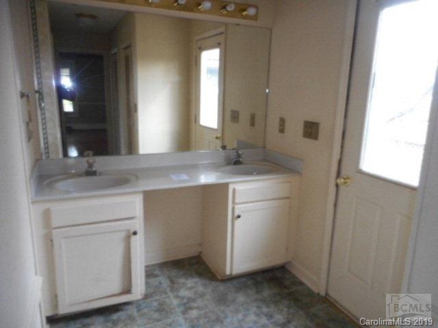 453 Poors Ford Road Rutherfordton, NC 28139 - Photo 12 of 15 a bathroom with a sink and a mirror