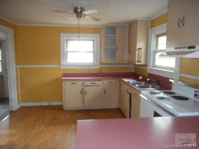453 Poors Ford Road Rutherfordton, NC 28139 - Photo 9 of 15 a kitchen with a sink stove and cabinets