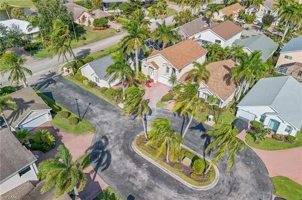 an aerial view of a house a yard and outdoor seating