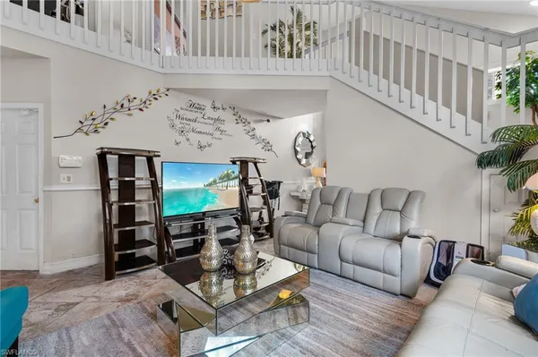 a living room with furniture and window