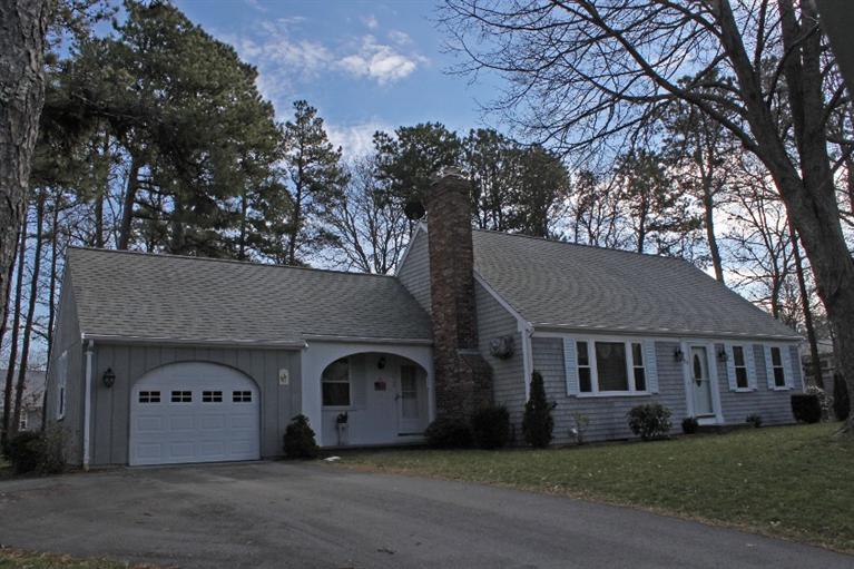 250 Cap'n Lijah's Road Centerville, MA 02632 - Photo 1 of 35 a front view of a house with a garden
