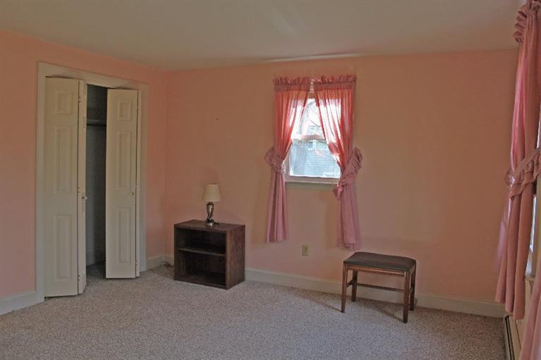 250 Cap'n Lijah's Road Centerville, MA 02632 - Photo 14 of 35 a room that has a window and a chair
