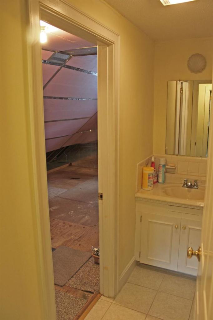 250 Cap'n Lijah's Road Centerville, MA 02632 - Photo 21 of 35 a bathroom with a sink a mirror and a shower