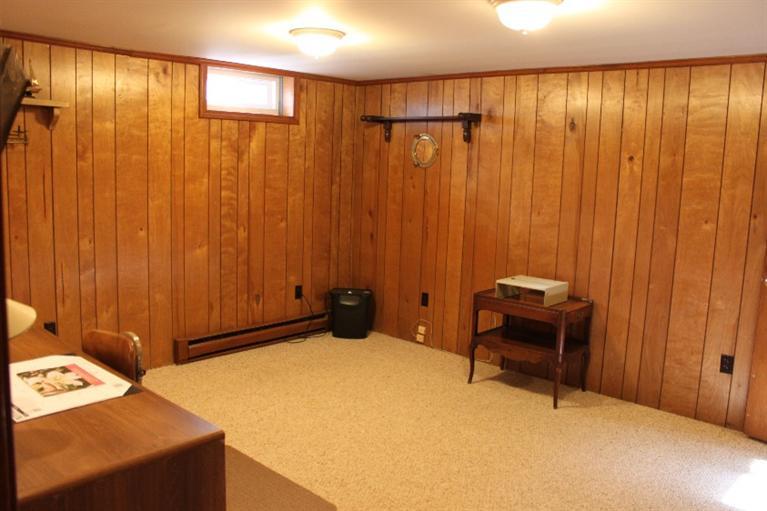 250 Cap'n Lijah's Road Centerville, MA 02632 - Photo 28 of 35 a bed room with a bed and a chair