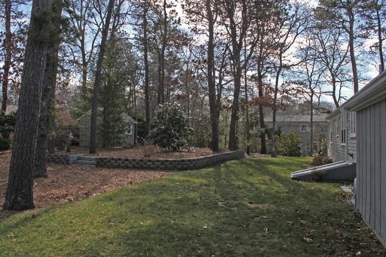 250 Cap'n Lijah's Road Centerville, MA 02632 - Photo 29 of 35 a view of a backyard with large trees