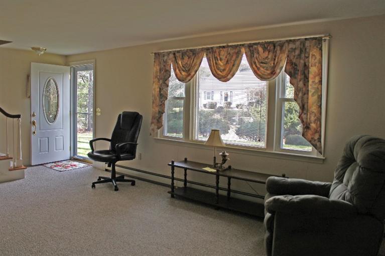 250 Cap'n Lijah's Road Centerville, MA 02632 - Photo 4 of 35 a view of a livingroom with workspace and a window
