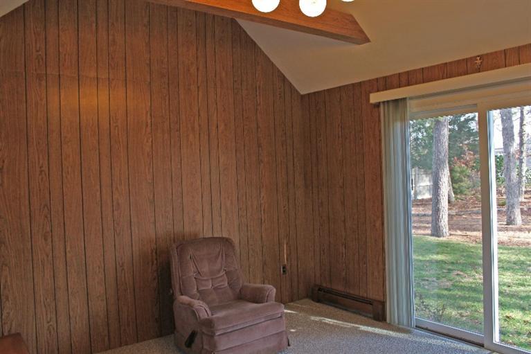 250 Cap'n Lijah's Road Centerville, MA 02632 - Photo 8 of 35 a room with a chair and a window