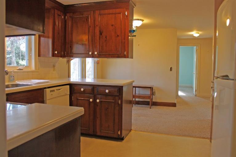 250 Cap'n Lijah's Road Centerville, MA 02632 - Photo 10 of 35 a kitchen with a sink cabinets and window