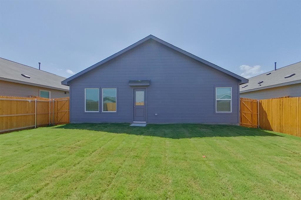 807 Ginkgo Way Princeton, TX 75407 - Photo 16 of 22 a view of backyard with hardwood