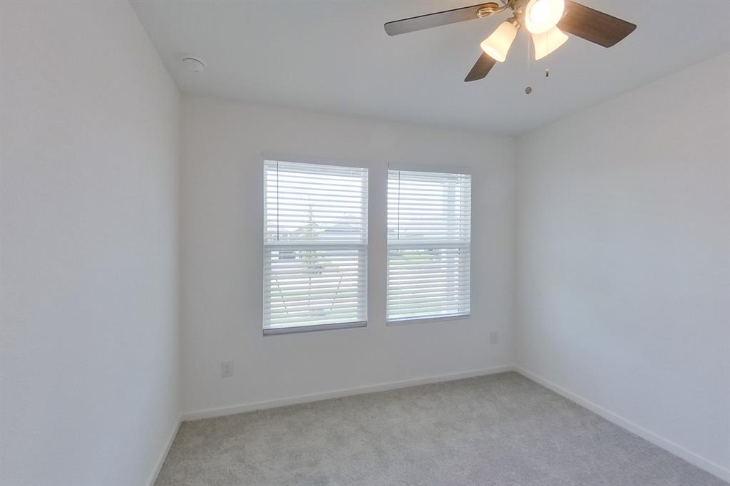 807 Ginkgo Way Princeton, TX 75407 - Photo 2 of 22 an empty room with a window