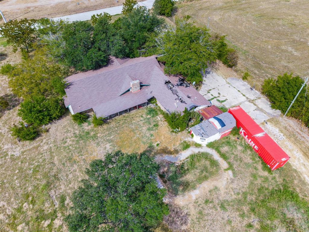 Single-story residence with a pitched roof and central chimney