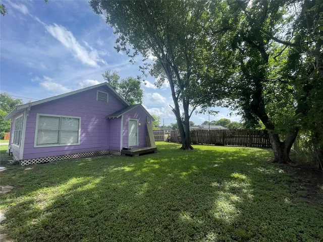 a backyard of a house with lots of green space