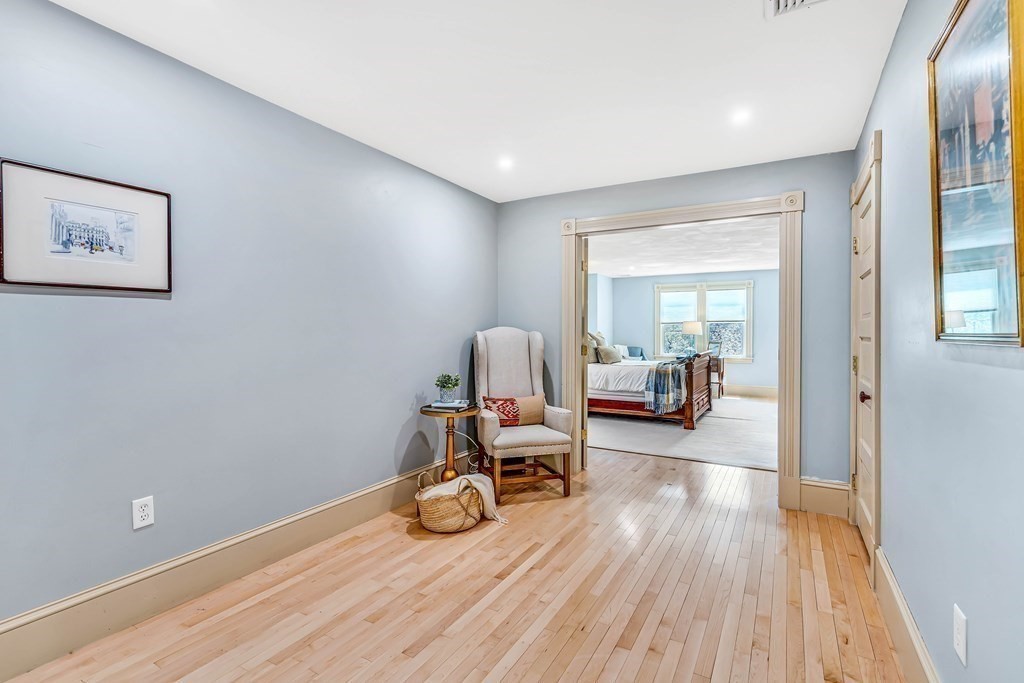 44 Derby Street Concord, MA 01742 - Photo 16 of 23 a view of a room with furniture and wooden floor